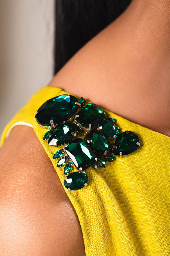 Rashi — green glass stone beading at the shoulder